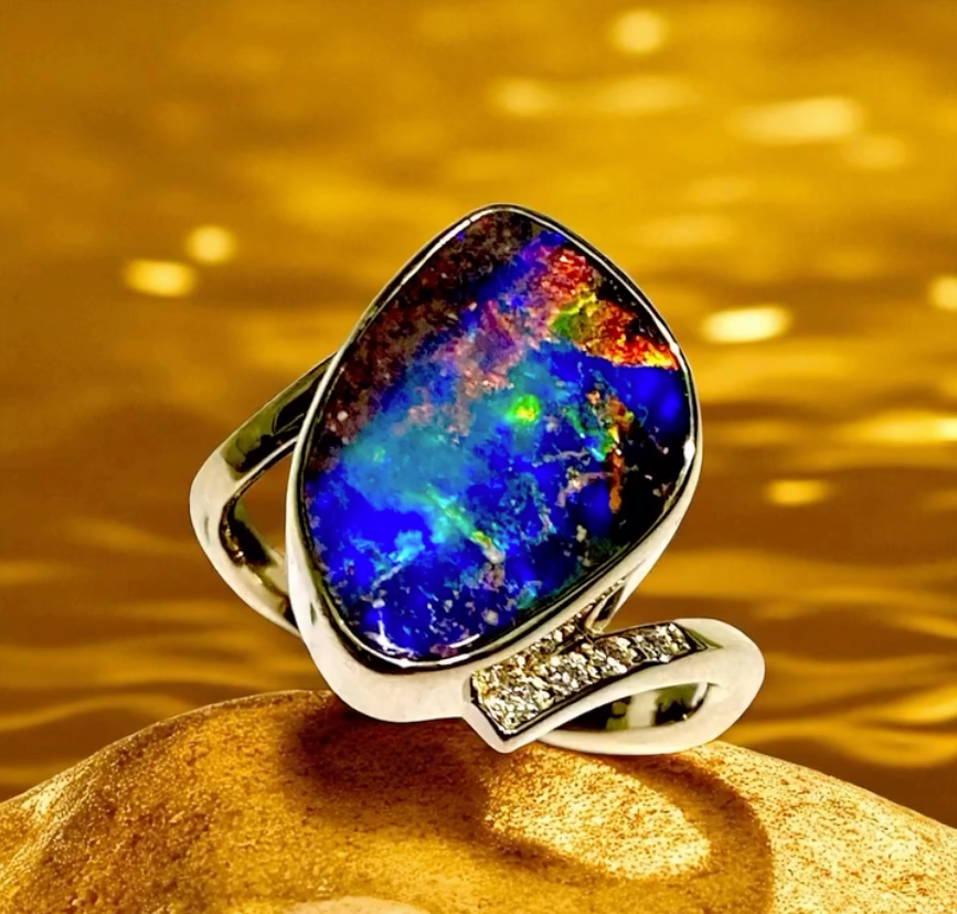 Opal Gemstone Ring With Swirling Blues, Greens, and Gold — Regency Jewellers in Cairns City, QLD