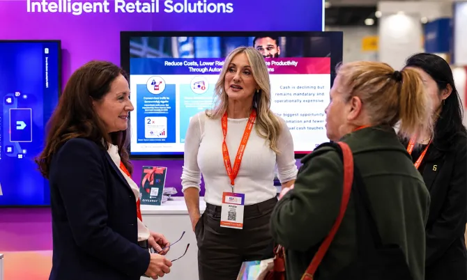 Retail Show Australia expo booth in pink and orange with “Resilience Re-invention Rebound” signage