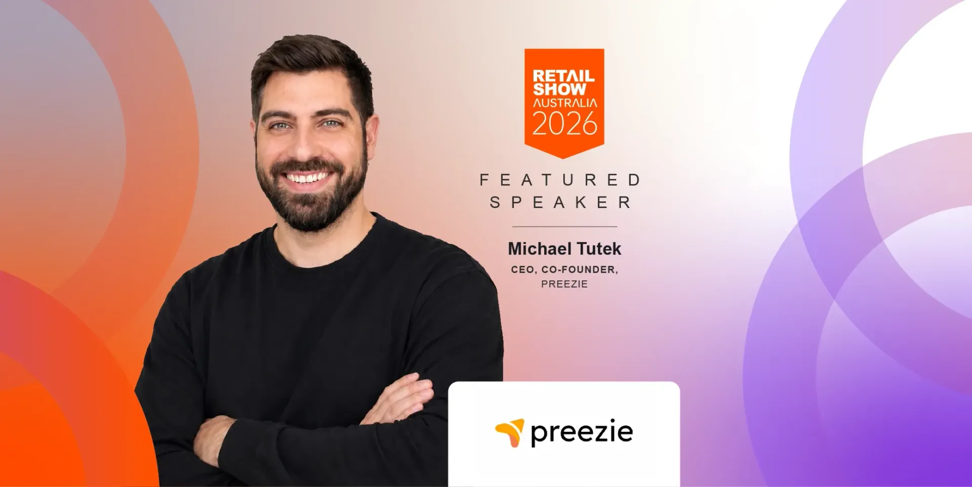 Smiling man in black shirt on a purple-orange Prezi-branded background with logo and text.