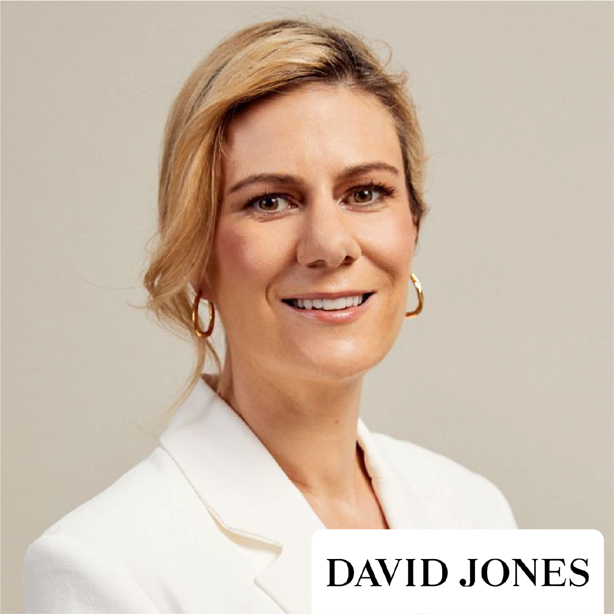 Portrait of a smiling person in a white blazer with David Jones logo