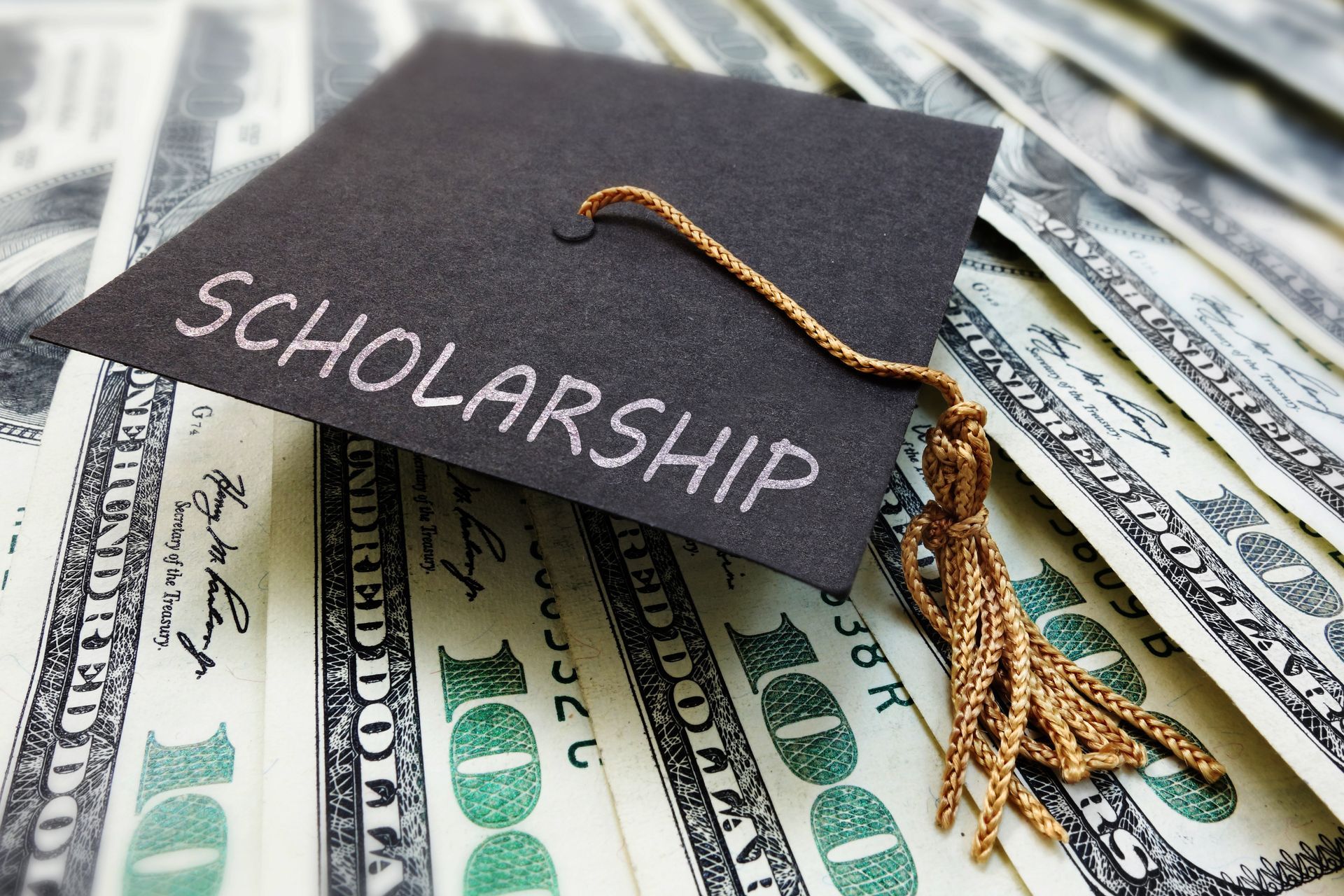 A graduation cap with the word scholarship written on it