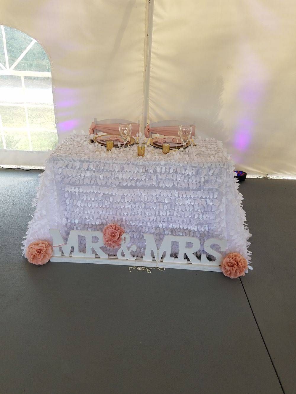 A white cake with the words mr and mrs on it