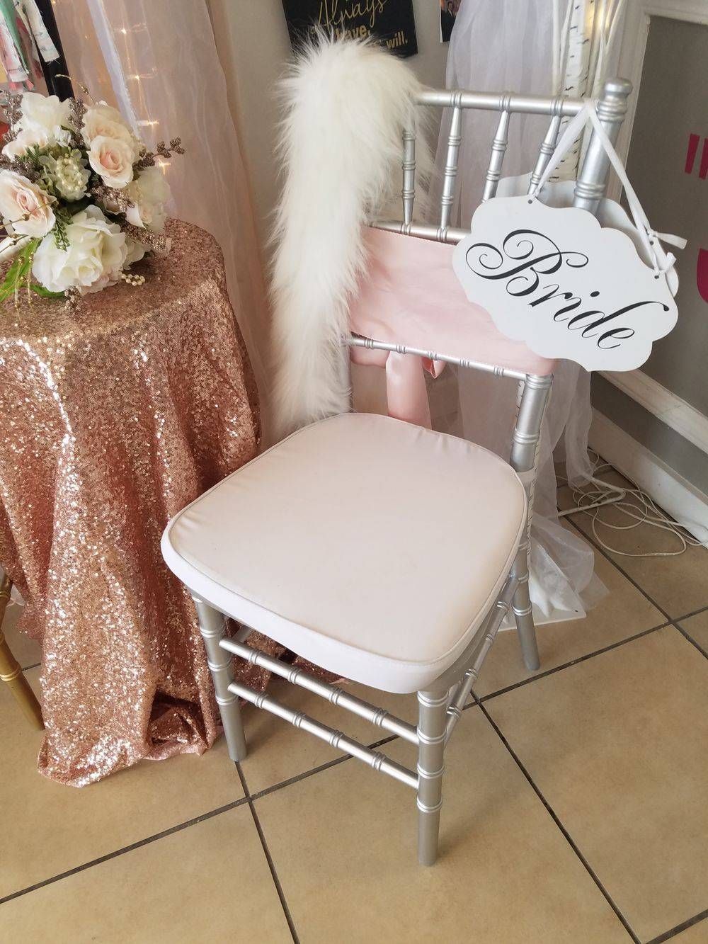 A chair with a sign on it that says `` bride ''.