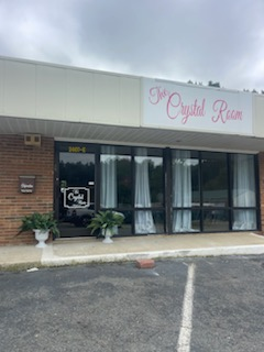 A building with a sign that says the crystal room