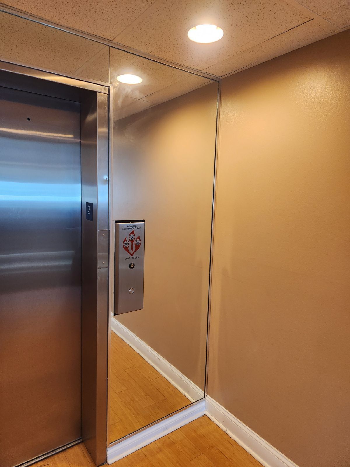 Mirror wall next to elevator in a commercial building in Downton Saint Pete, FL, done by City Glass and Mirror.