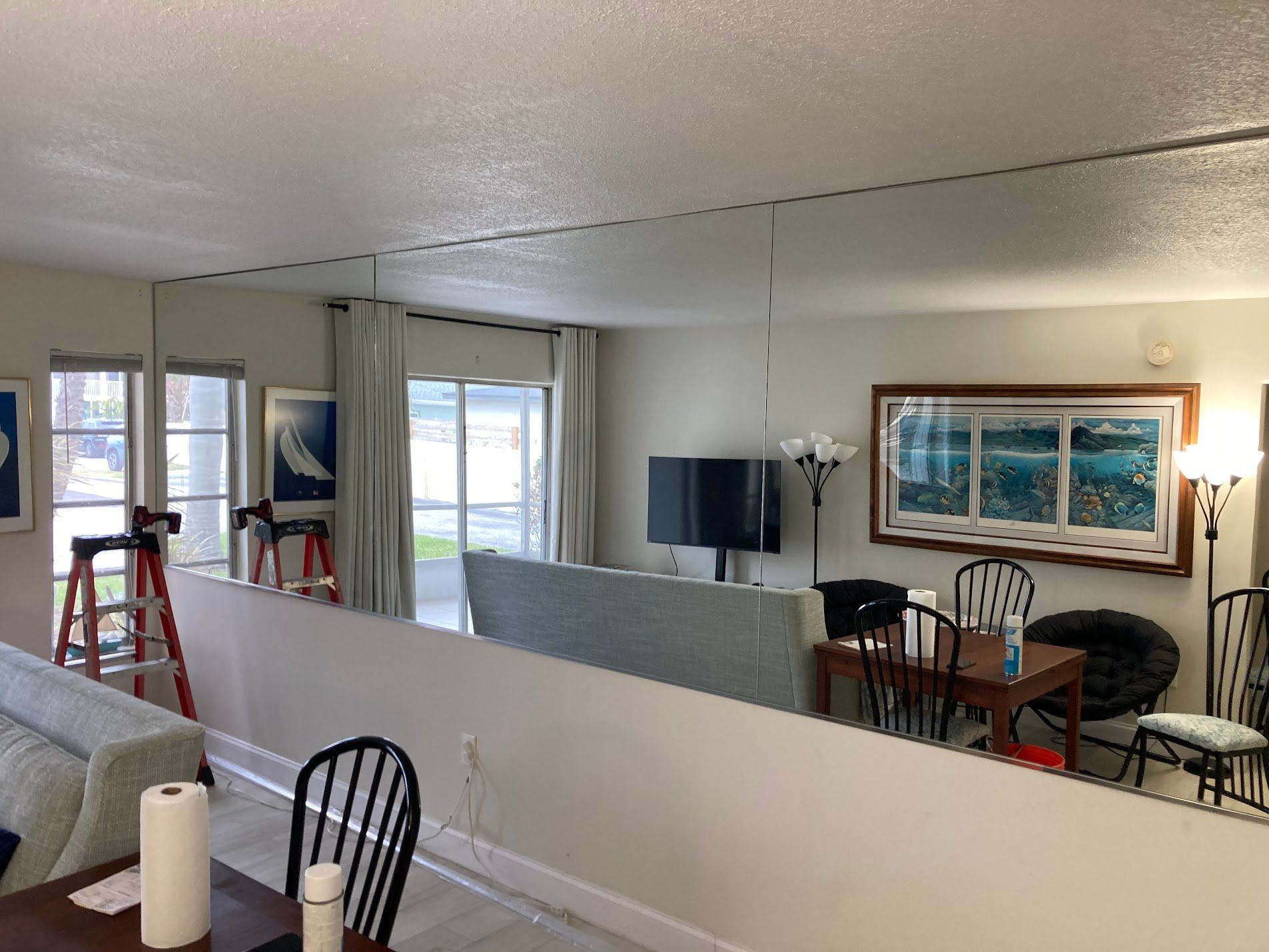 Mirror wall in a beautiful condo to open and make the space feel bigger in Saint Pete, done by City Glass and Mirror.