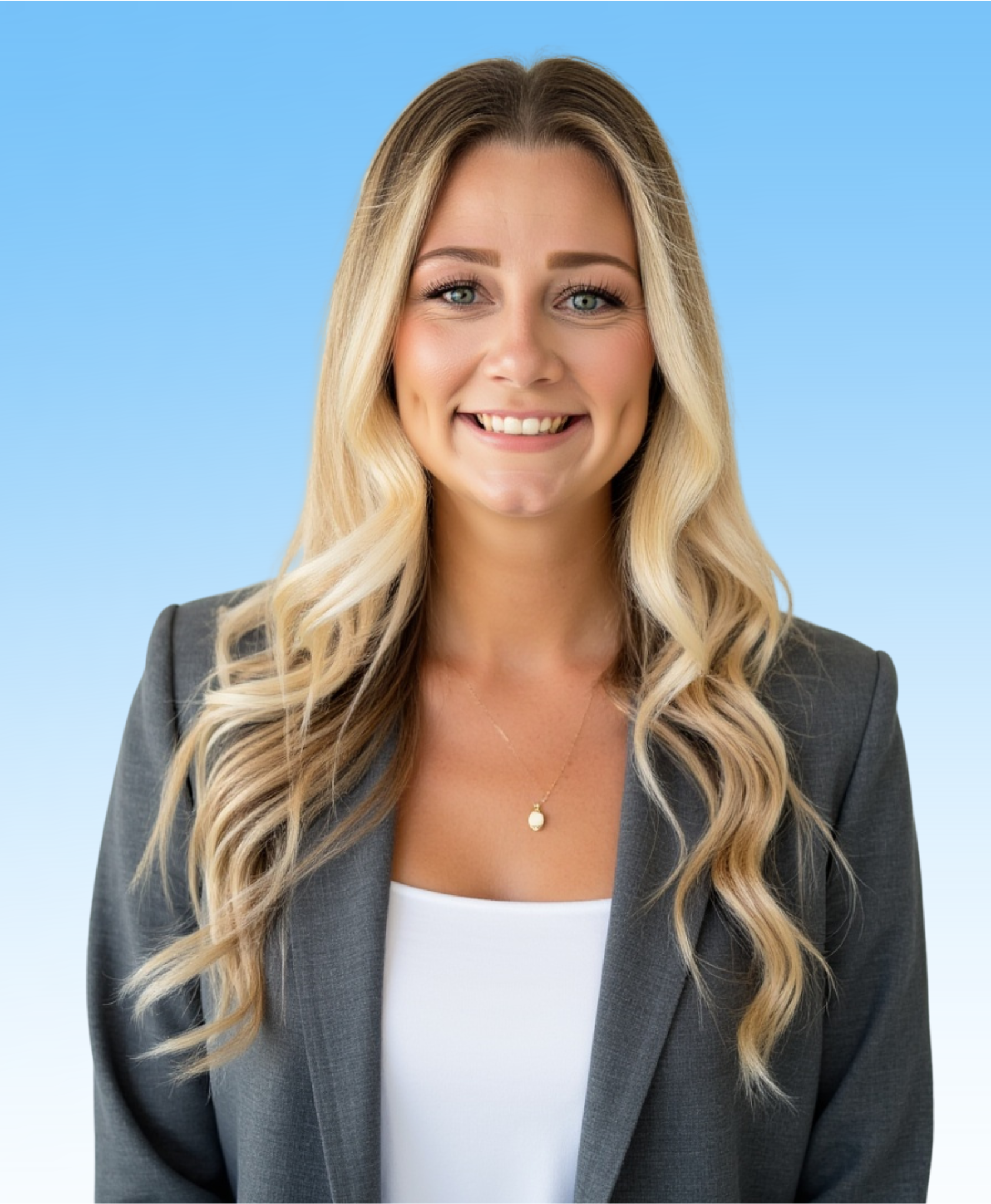 A woman in a black suit with her arms by her side, standing in front of a blue gradient background.