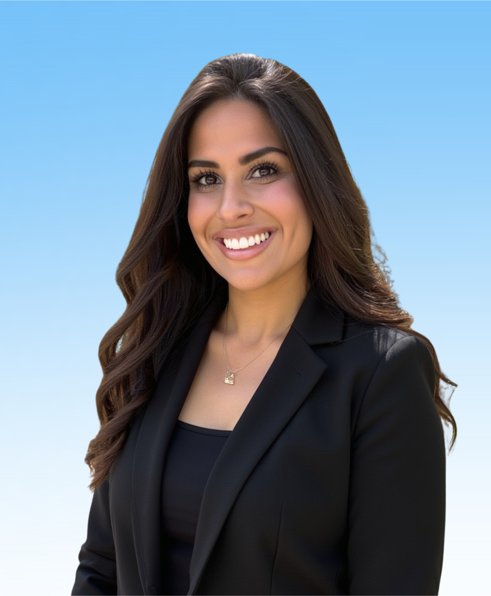 A woman in a black suit with her arms by her side, standing in front of a blue gradient background.