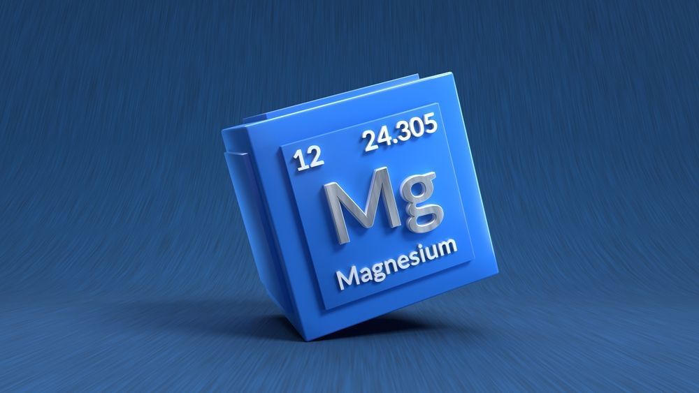 Blue cube of magnesium element from the periodic table; symbol 