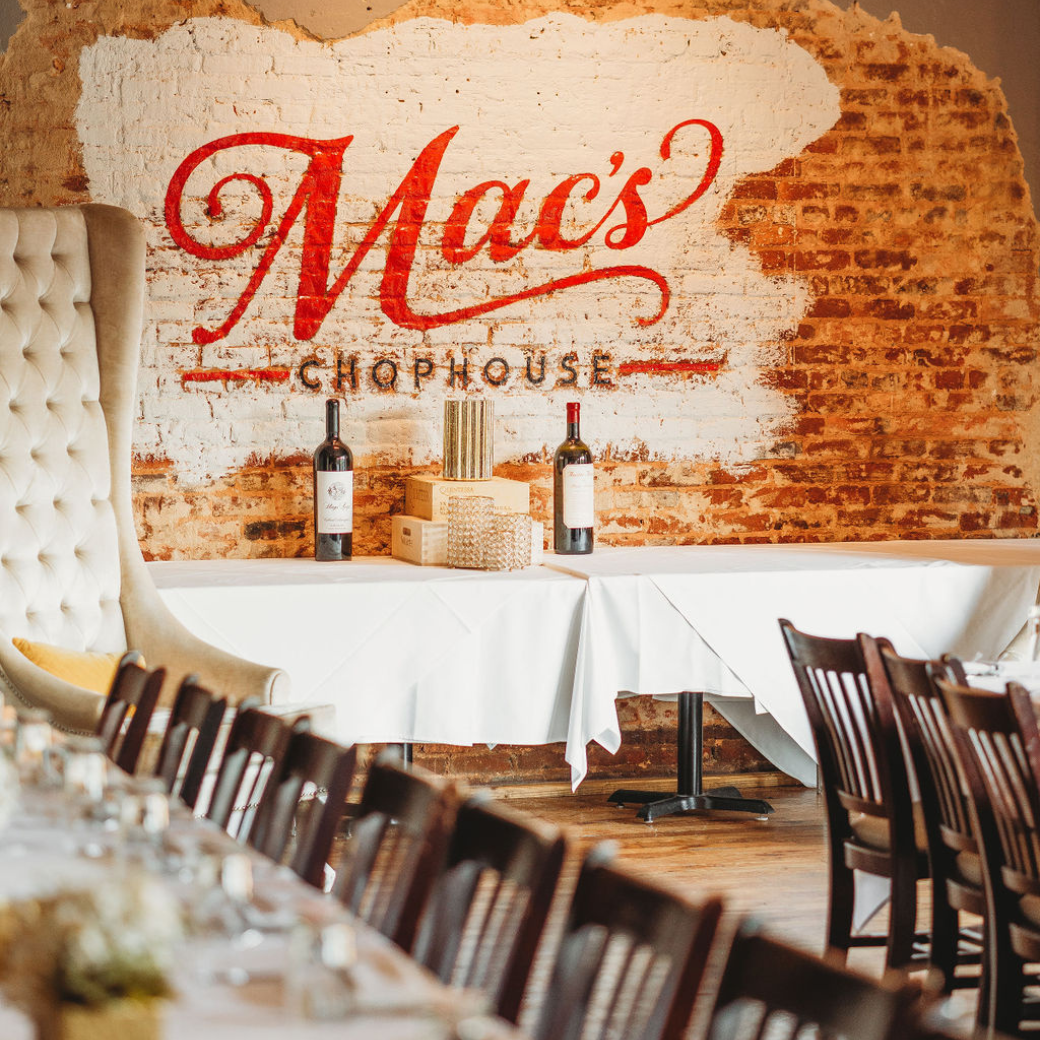 A mac 's chophouse restaurant with tables and chairs