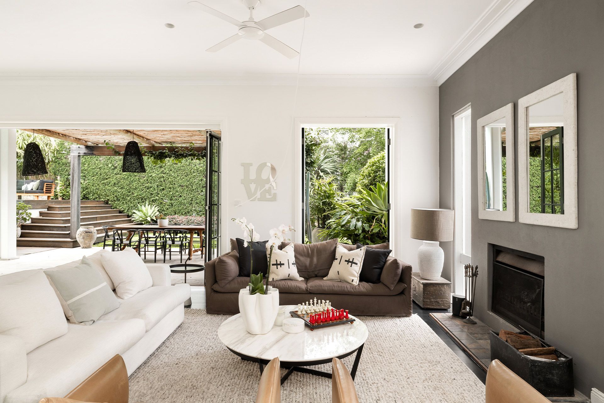 A living room filled with furniture and a fireplace.