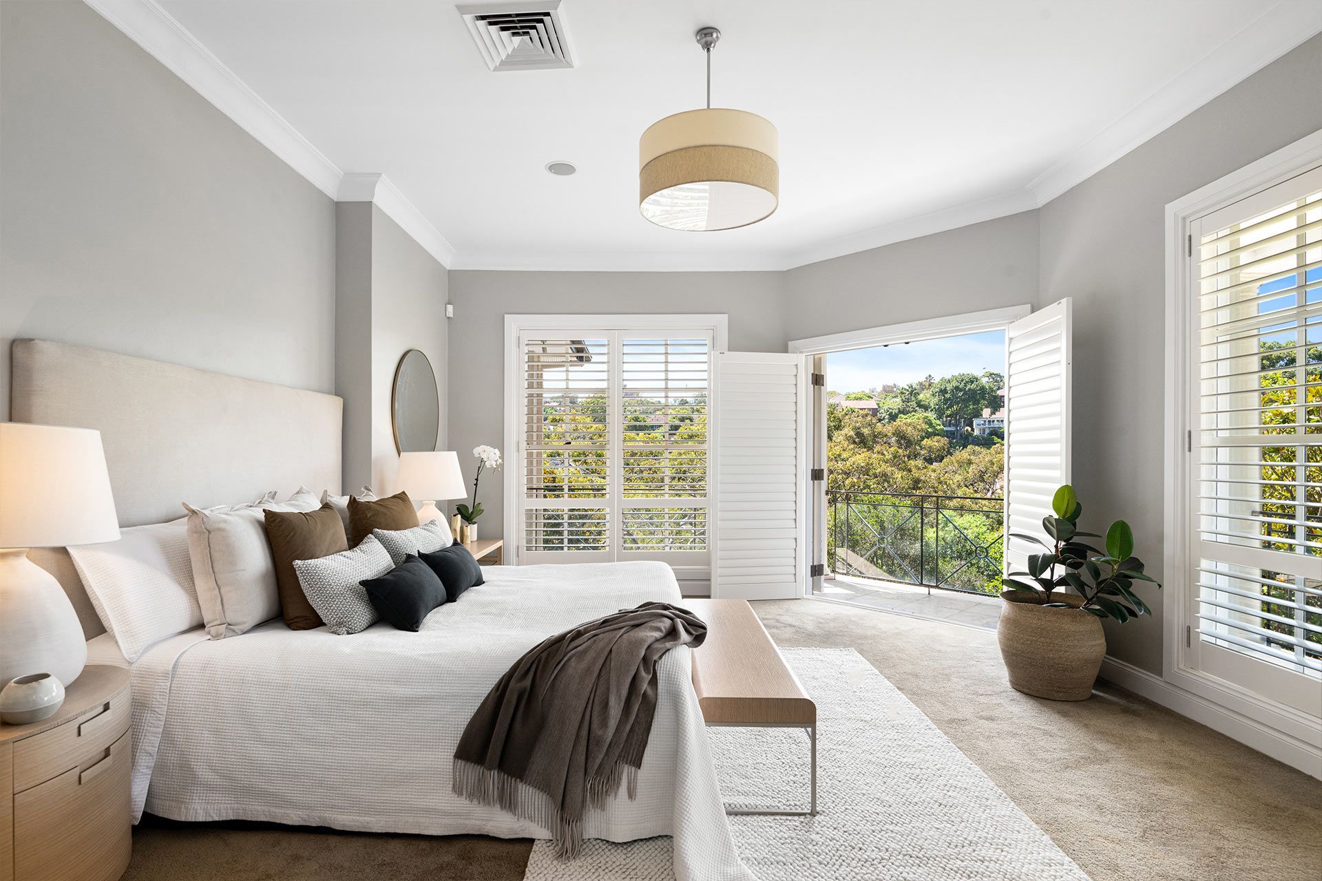 There is a large bed in the middle of the room. Beauty Point.