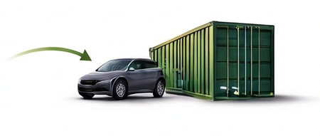 Gray car beside a green shipping container with an arrow pointing toward the container