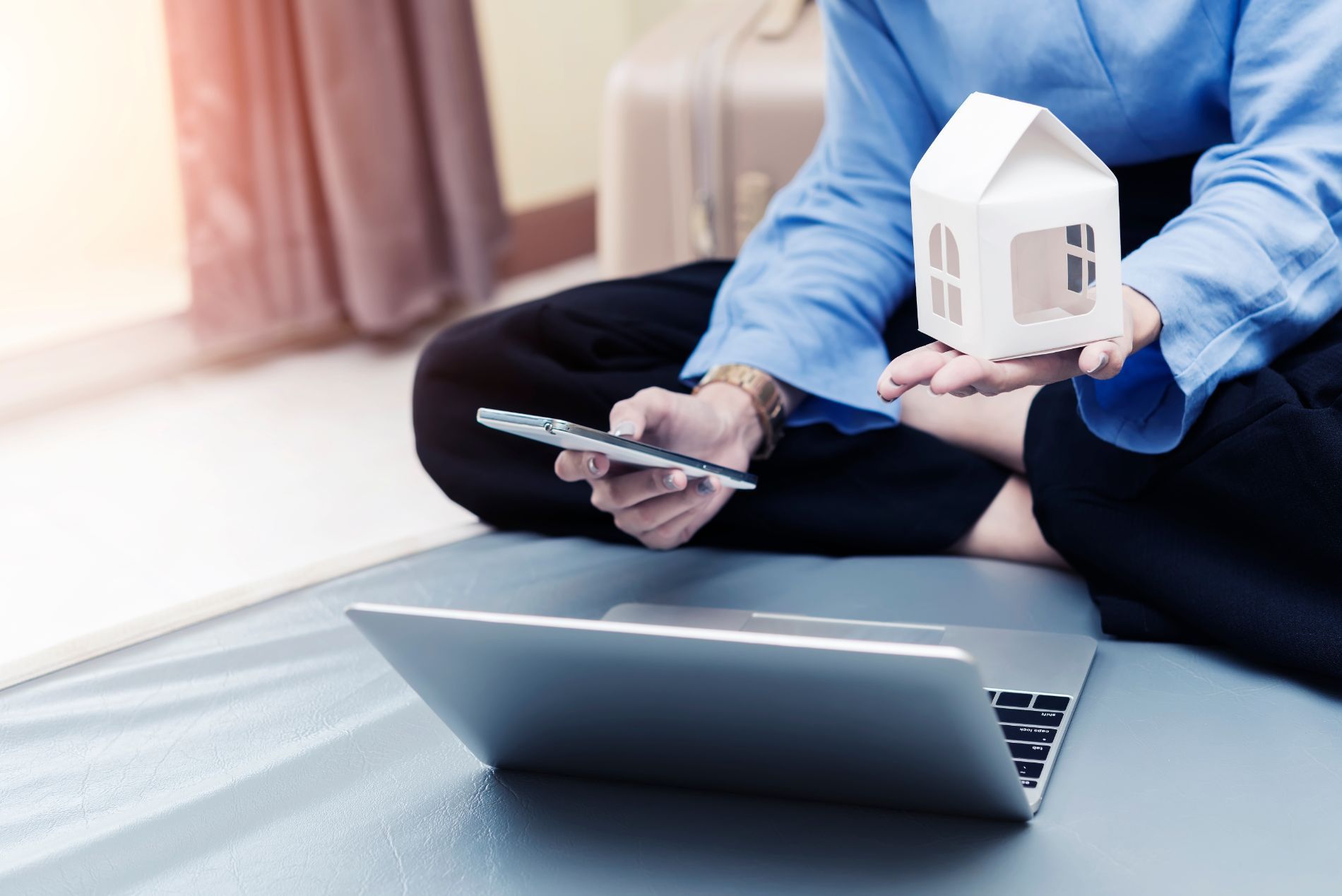 Client looking at phone and laptop