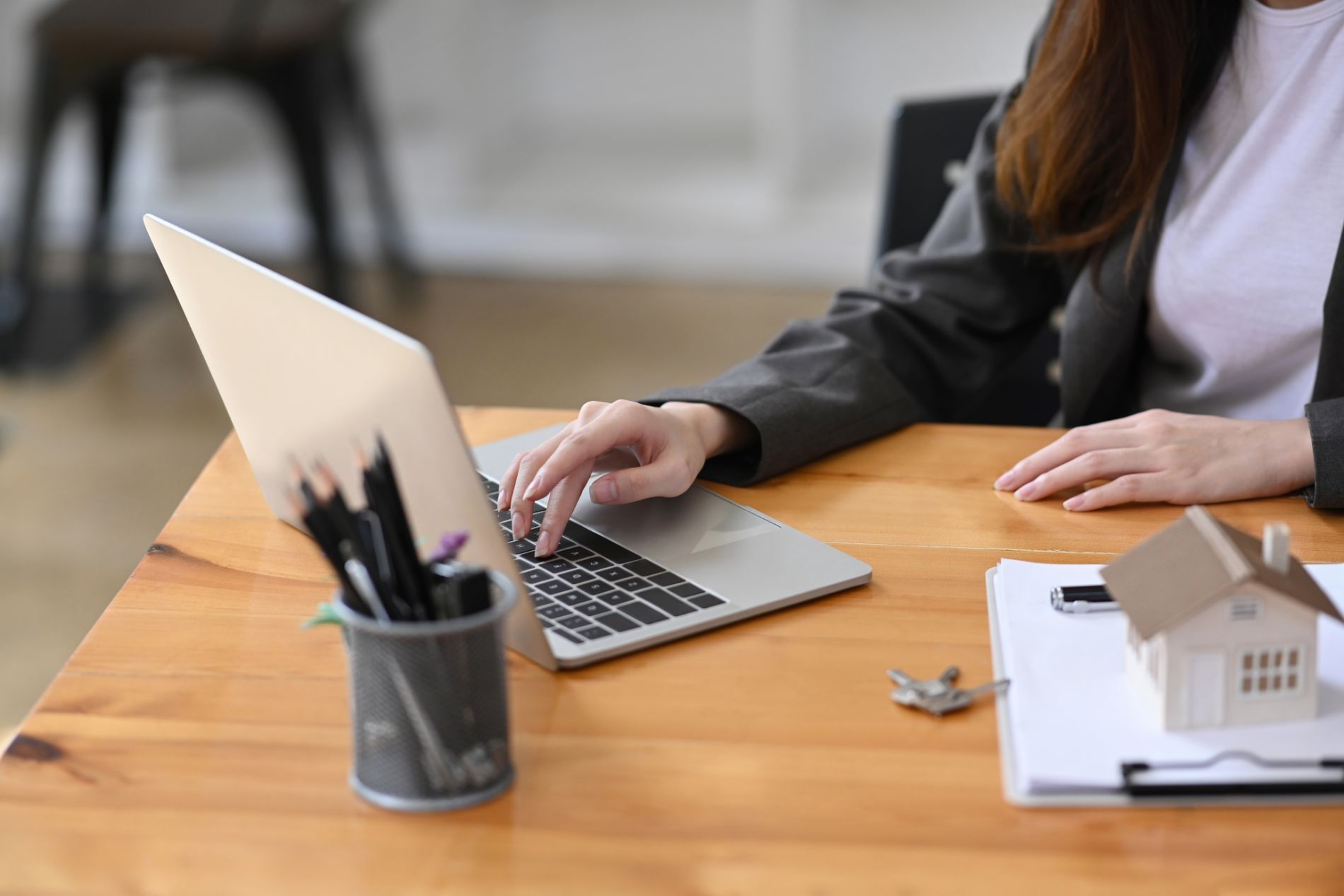 Estate planner typing on laptop
