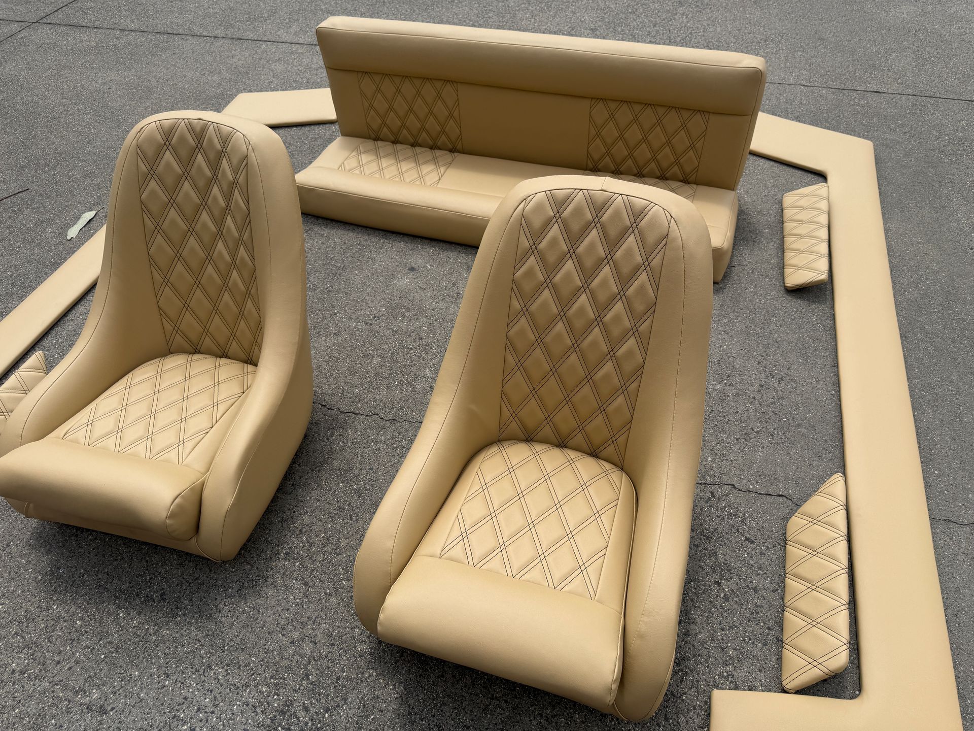 Piranha boat seats in Capri Driftwood vinyl with black diamond twin stitch