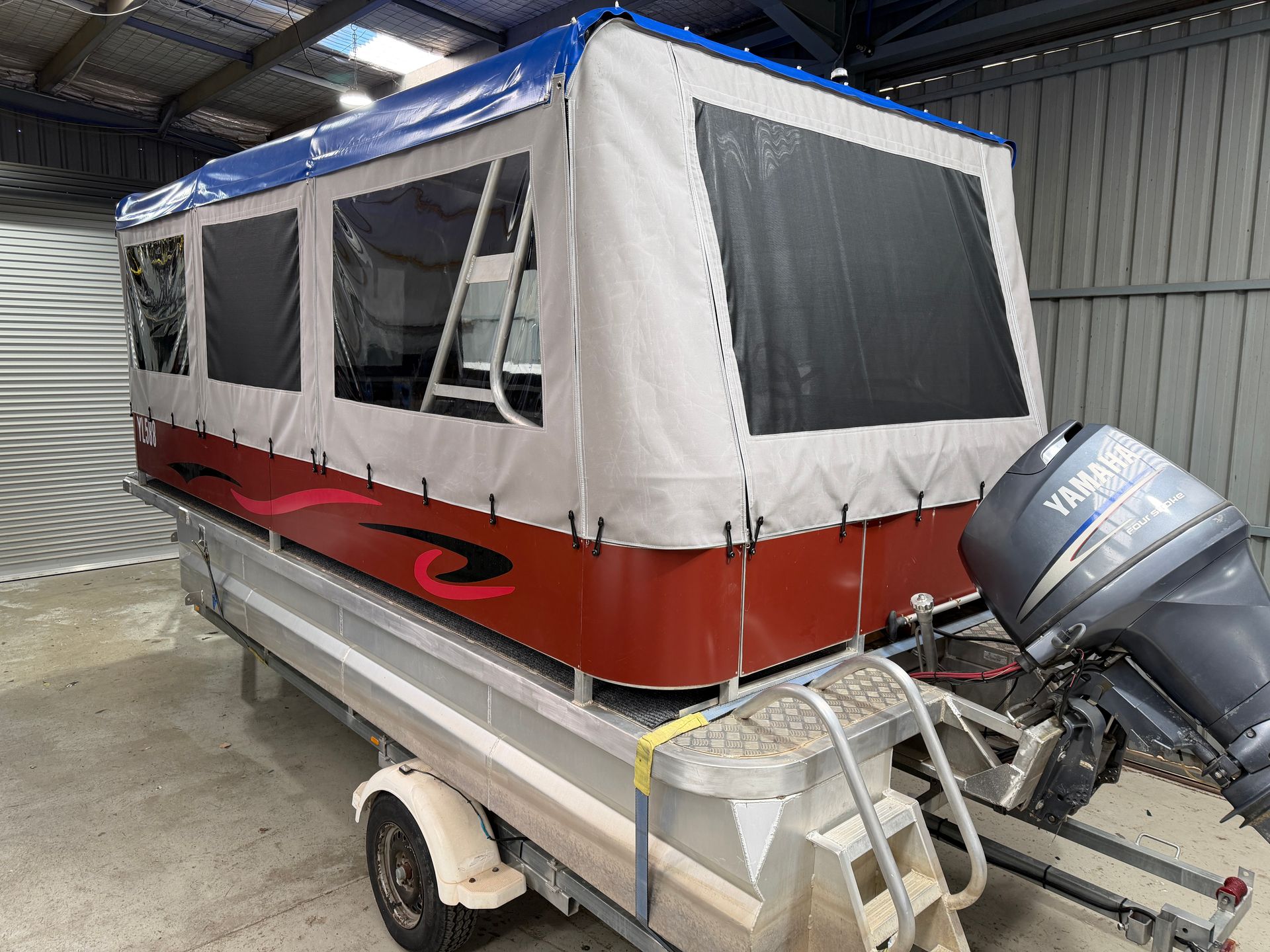 Pontoon boat blue PVC roof, grey acrylic canvas sides with mesh and clear PVC windows