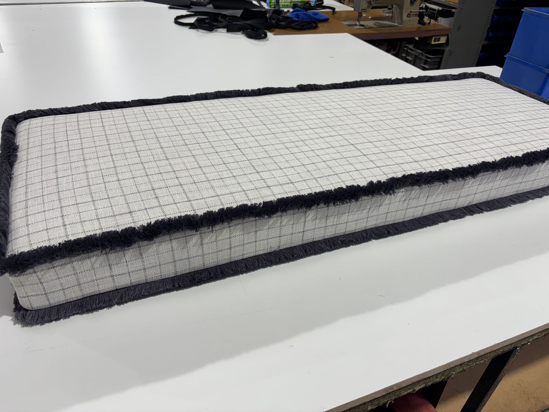 Custom reversible cushion in supplied material with piping