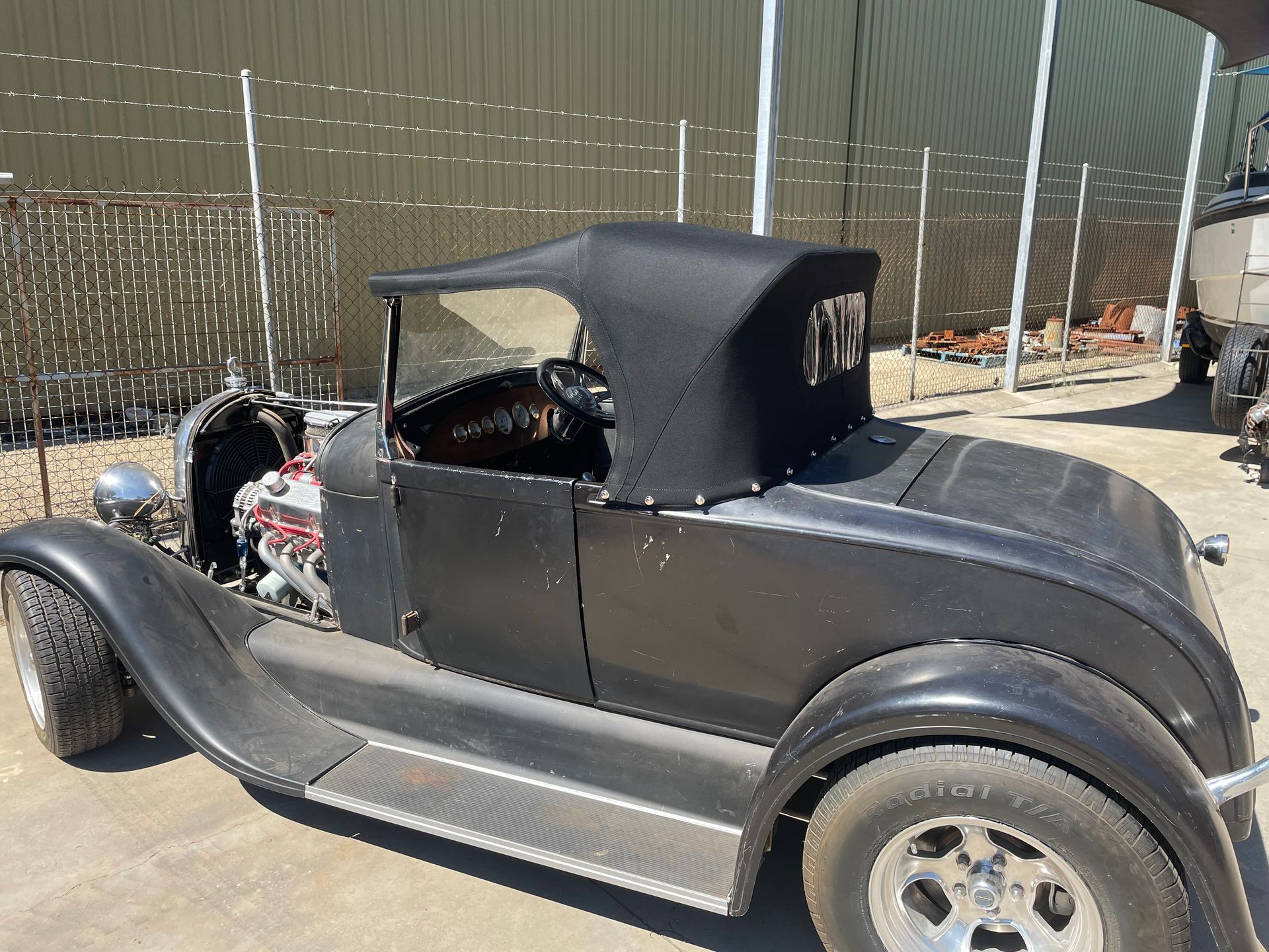 A Model Roadster Stayfast canvas top with clear window