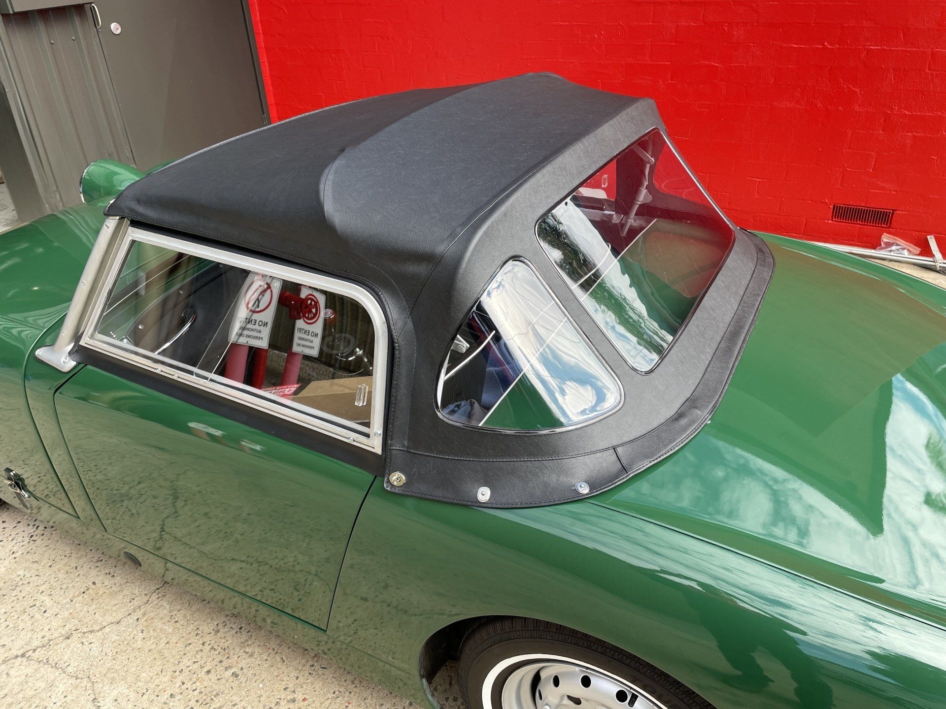 Austin Healey Sprite black vinyl soft top installation
