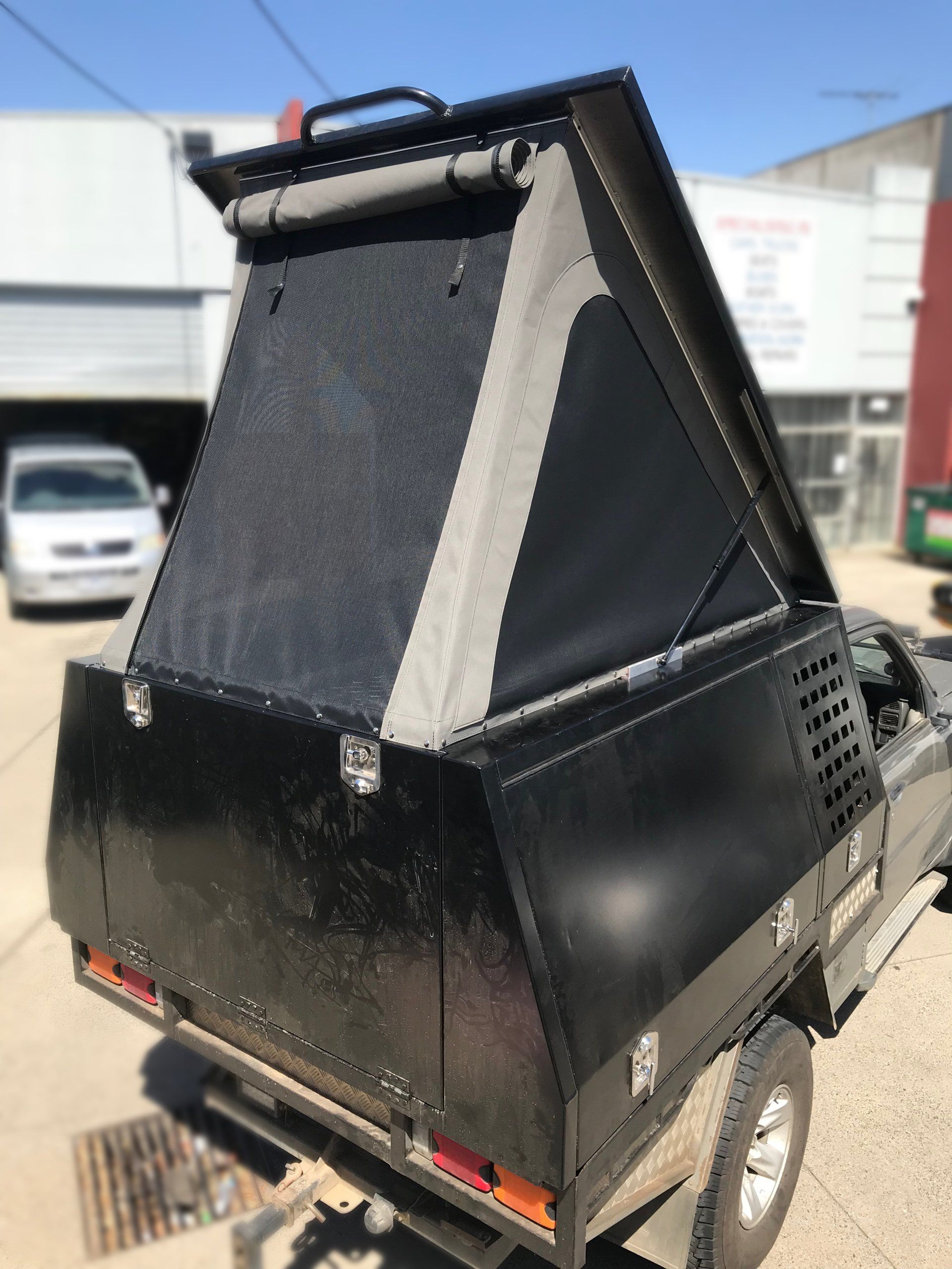 Canvas lift up tent with mesh windows on ute