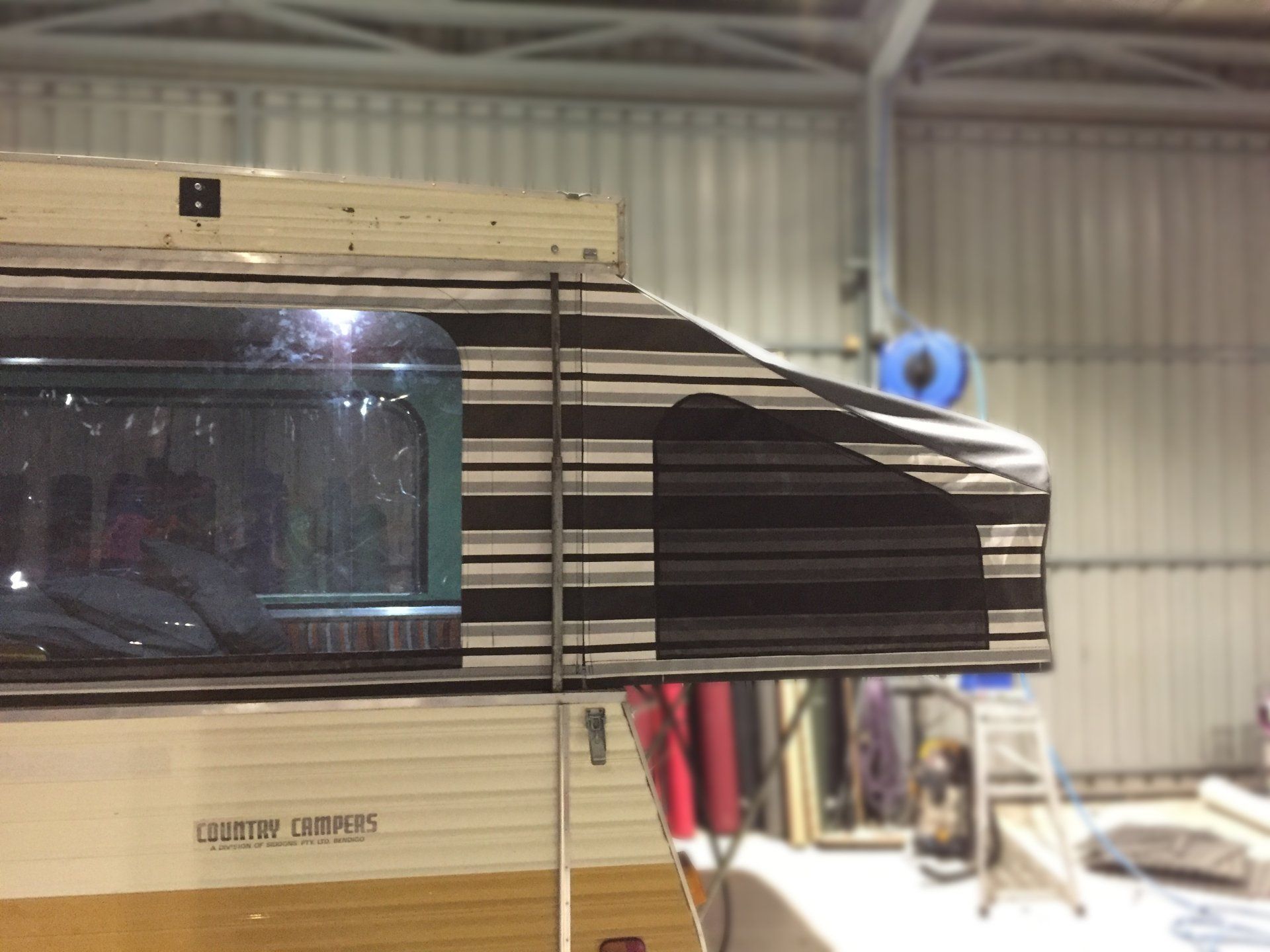 Country Camper pull out striped canvas caravan bed ends