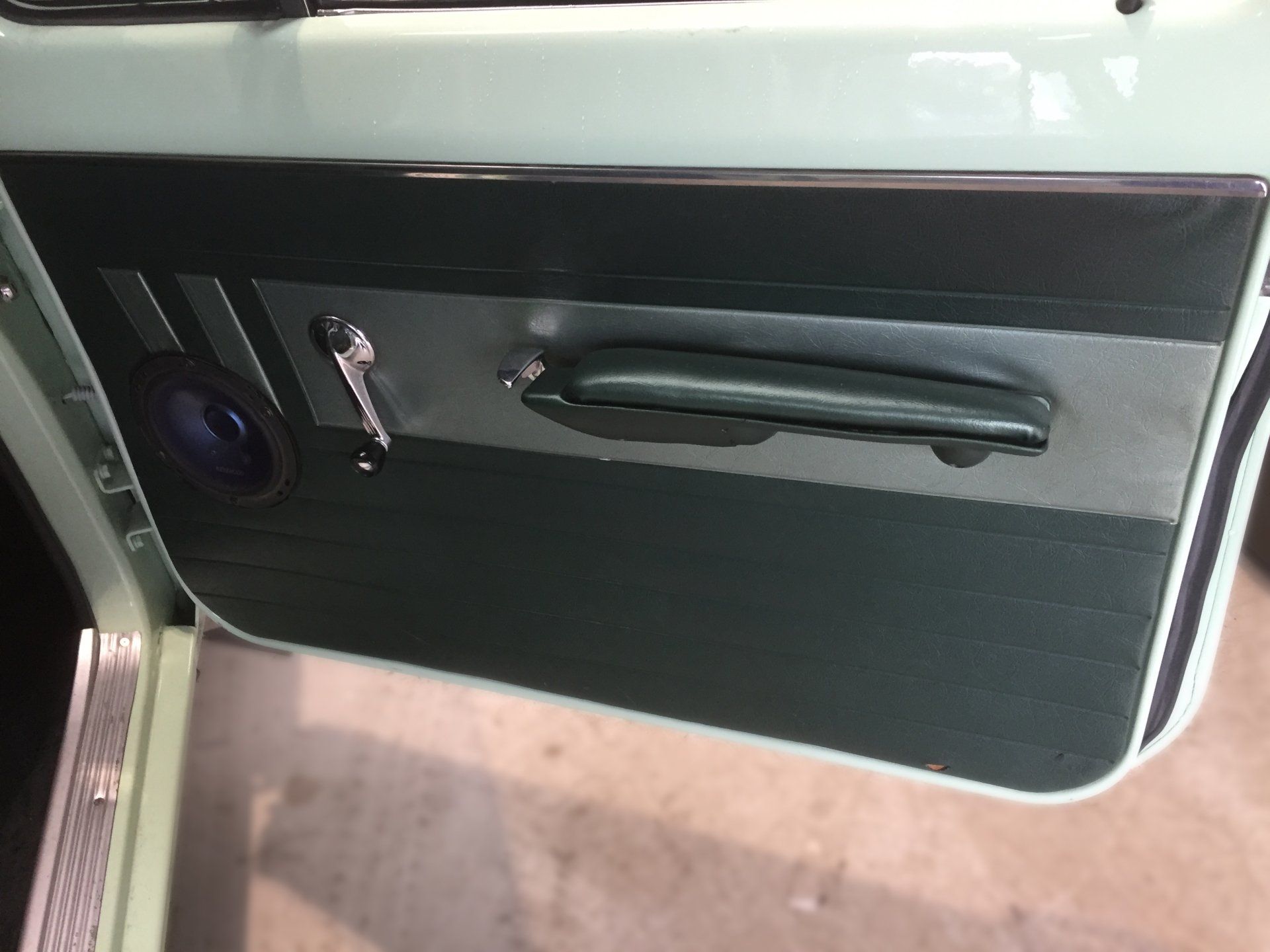 EH Holden Special dark green with metallic green door trim and arm rest