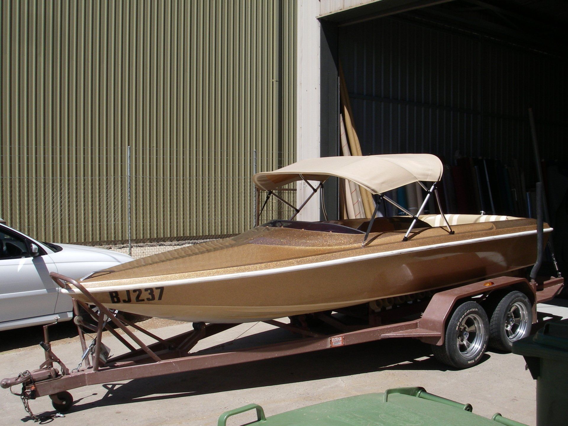 Gold Ski Boat with Bimini
