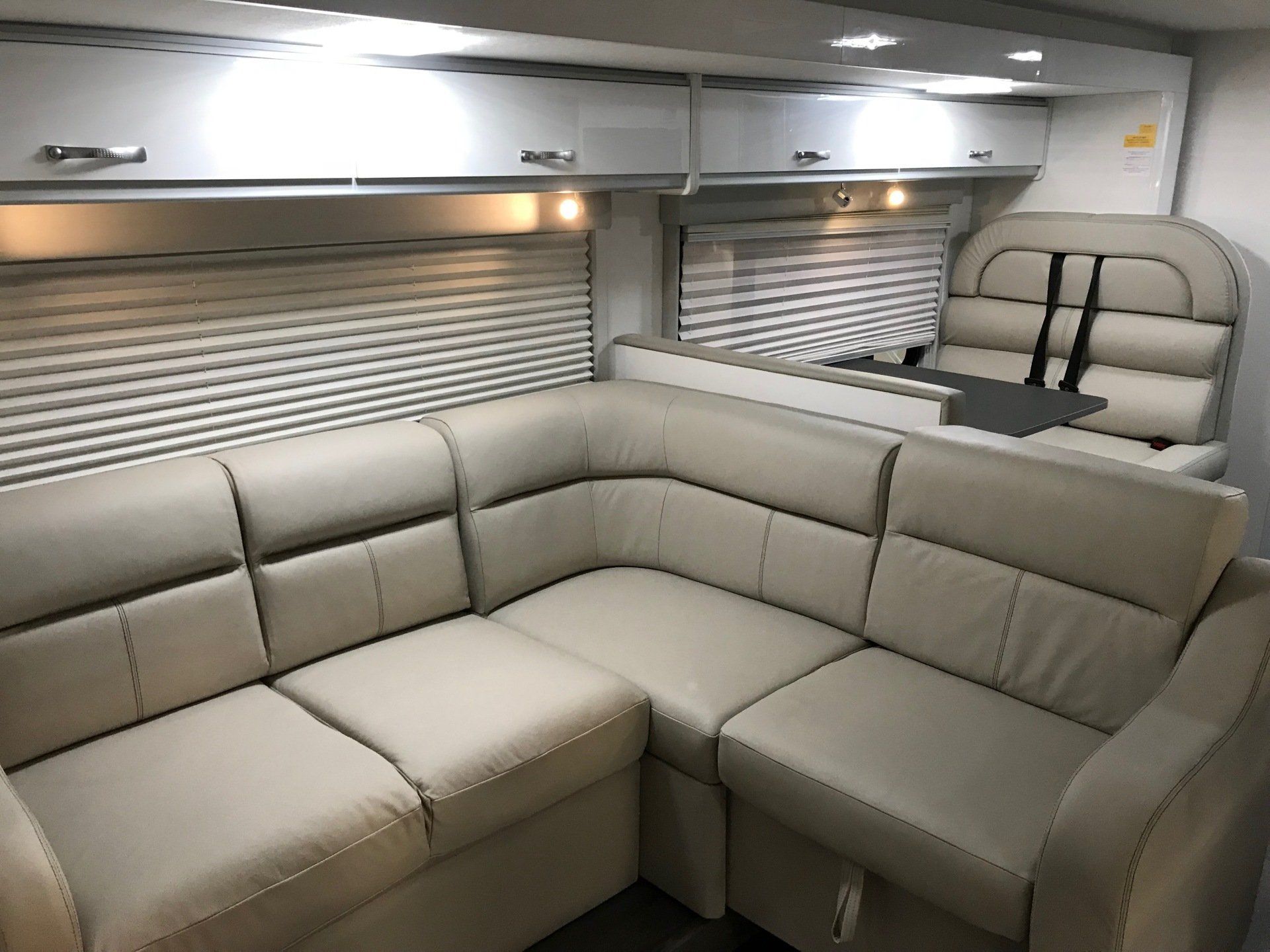 Motorhome lounge and dinette setting in cream leather