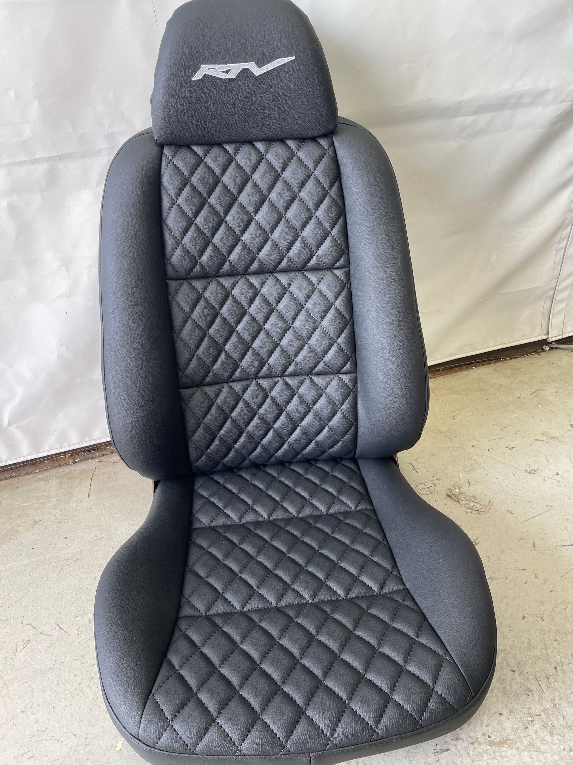 RTV custom black leather with cross stitch bucket seat