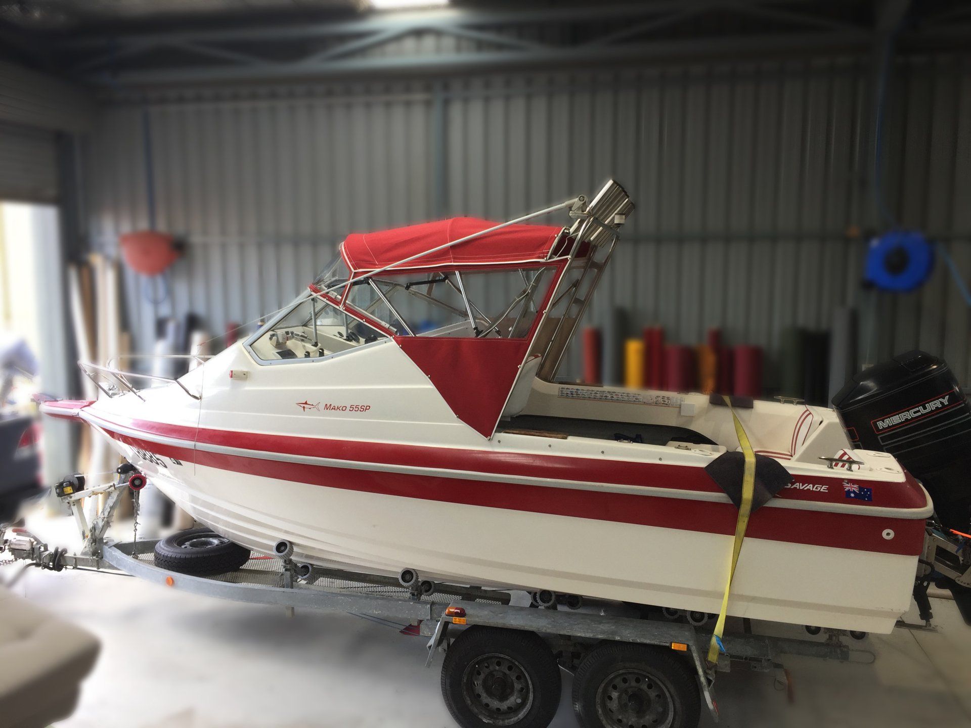 Savage Mako 55SP bimini, clear front and side curtains off rocket launchers