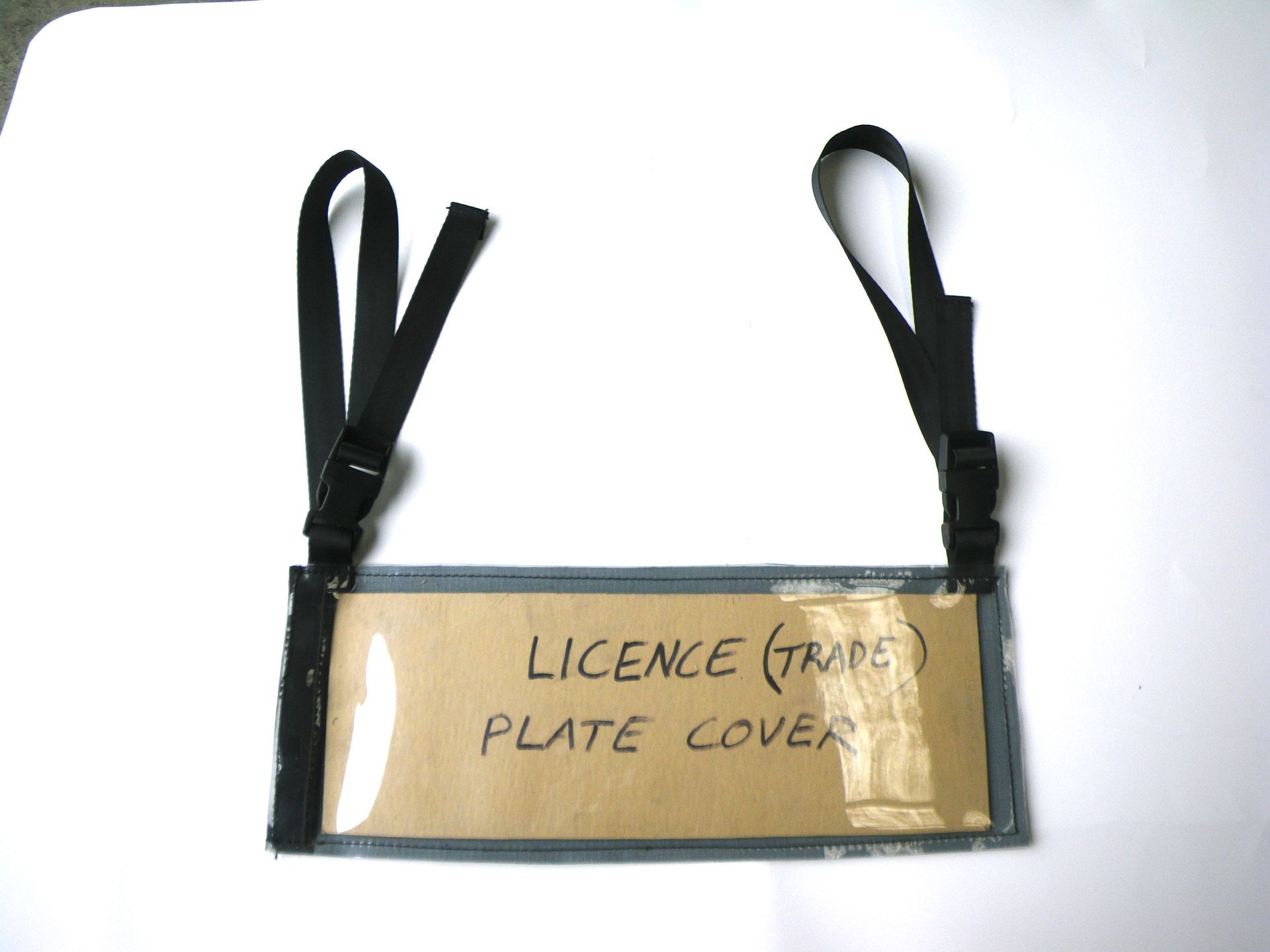 Trade plate cover double strap