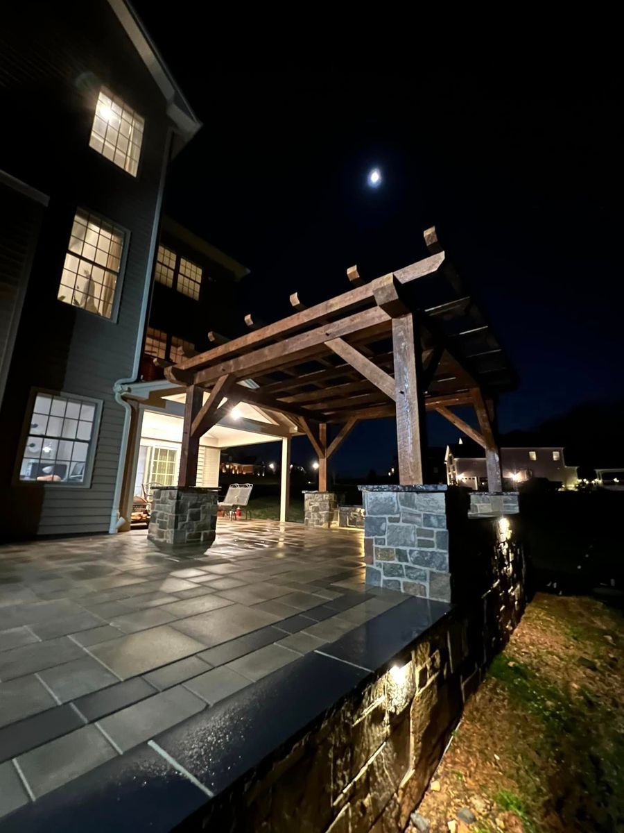 A wooden pergola built by Custom Timber Frame Supply 