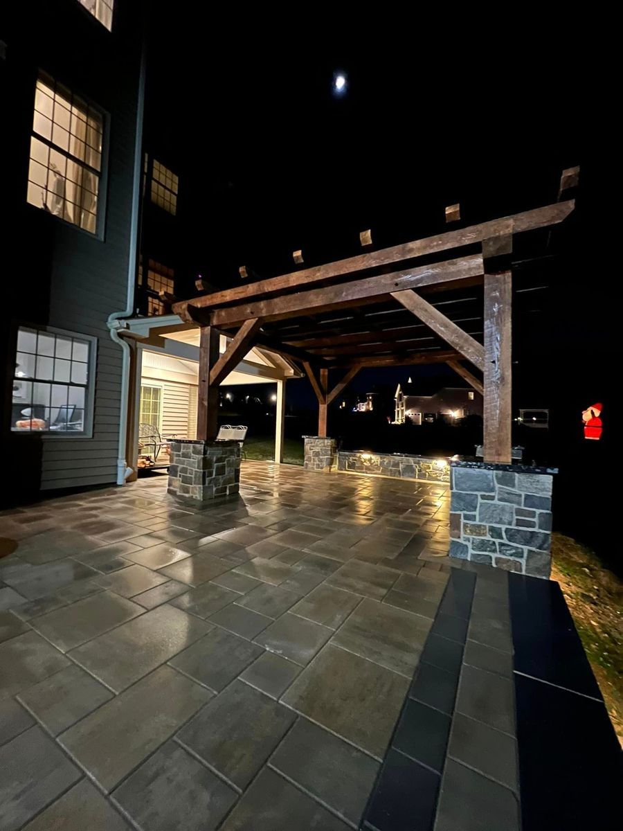 Central Timber Frame Supply built wooden pergola, illuminated by soft  structure lighting in PA WV, VA, OH, NJ, NY.