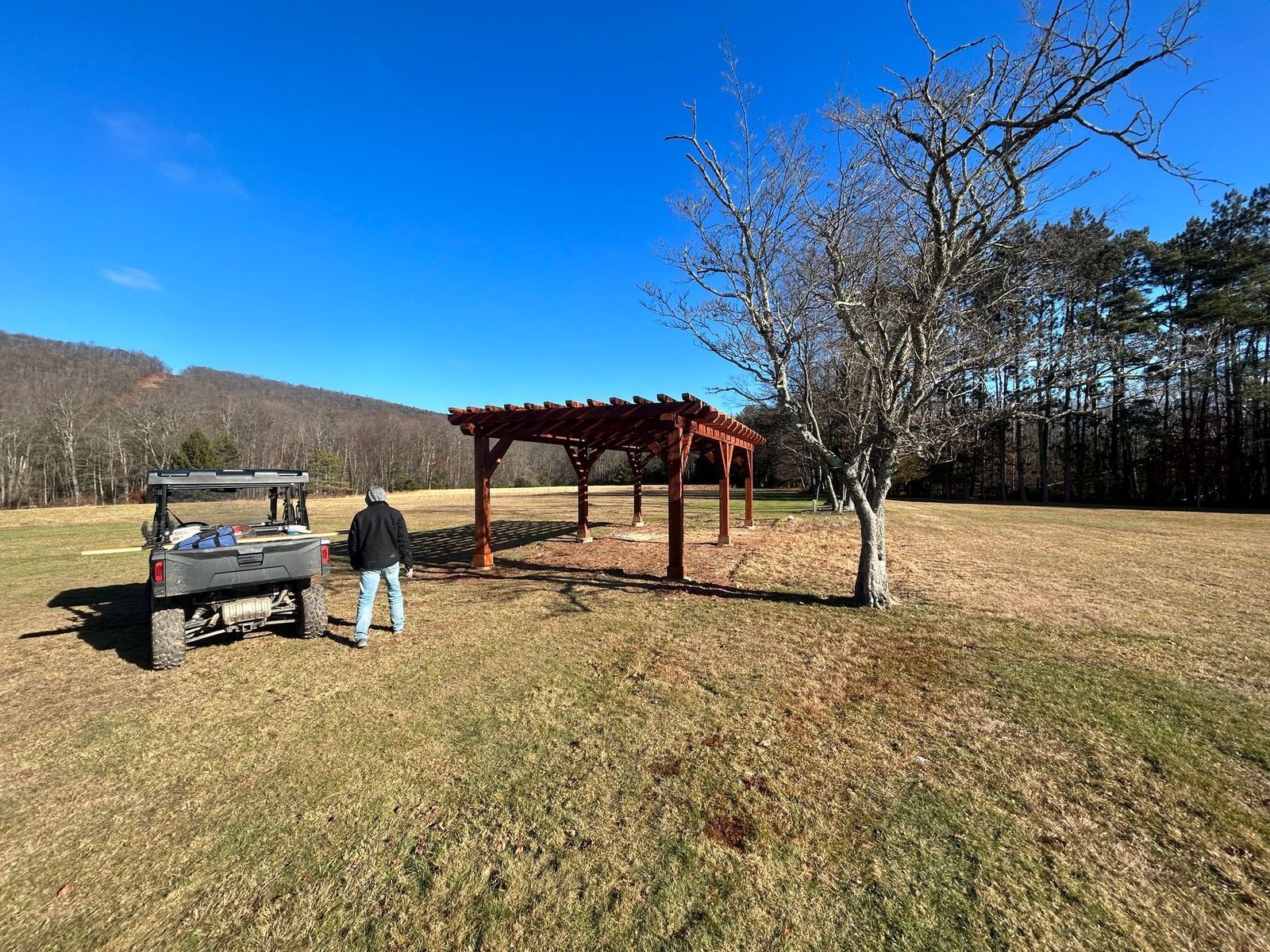 Awooden pergola built by Custom Timber Frame Supply. 