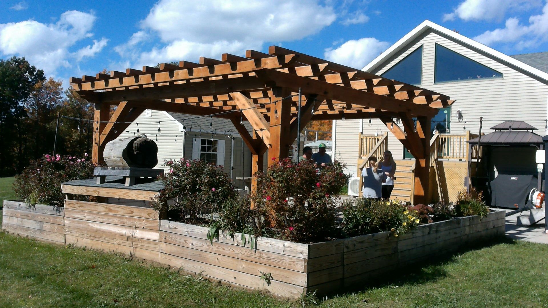 A wooden pergola built by Central Timber Frame Supply.