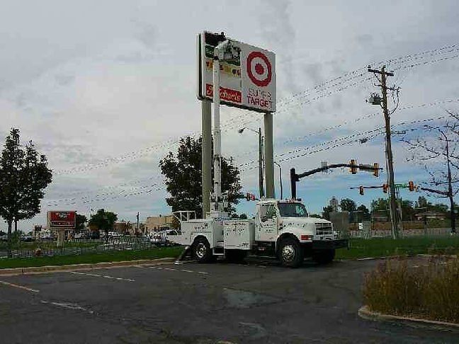 Worker Repairing Signage Lights — West Valley City, UT — GLS Electric