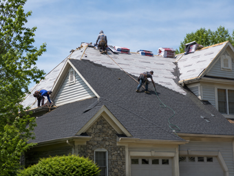 Gray shingled roof with a white dormer and ridge detail