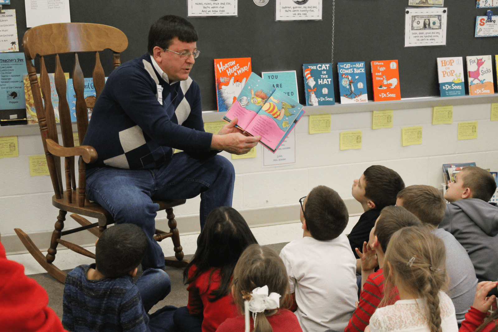 Dr. Lambert reading a Dr. Seuss book to schoolchildren in Bethlehem, PA