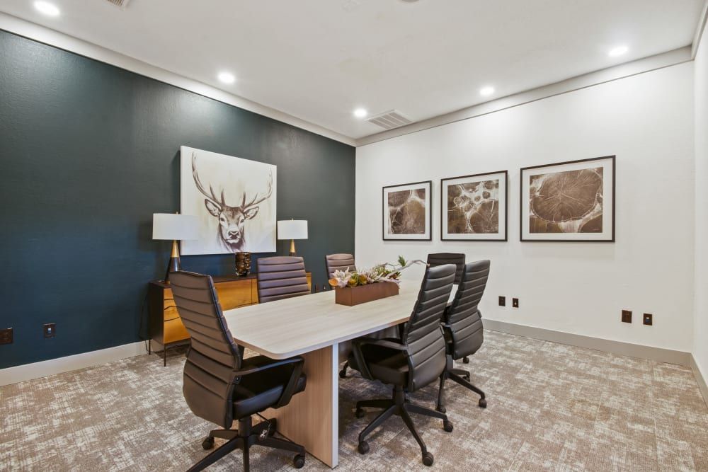 a conference room with a long table and chairs at Marquis on Evans in San Antonio, TX.