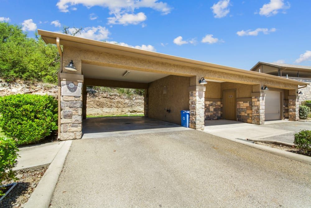 a house with two garages and a driveway leading to it at Marquis on Evans in San Antonio, TX.