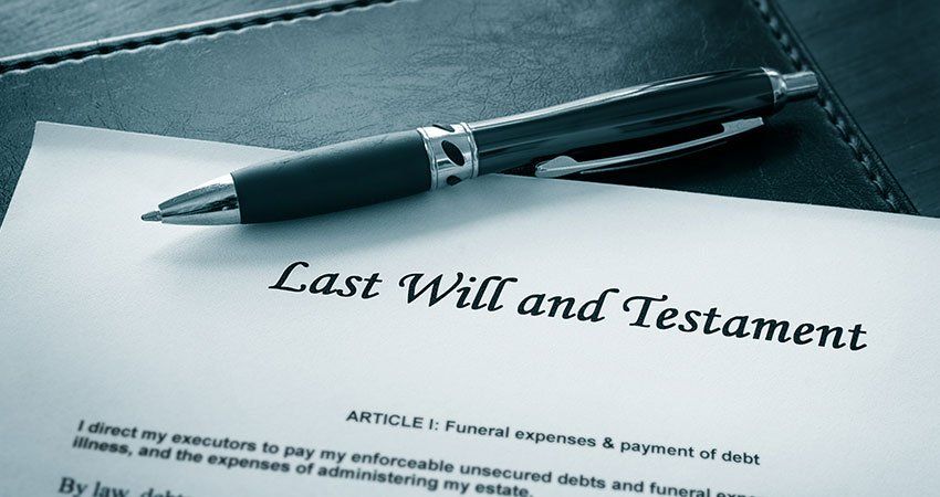 pen resting atop a last will and testament