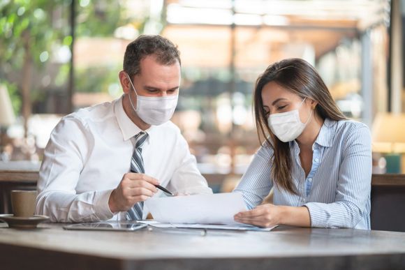 Lawyer and Client Wearing Face Masks — Eugene, OR — Alan G. Seligson, P.C.