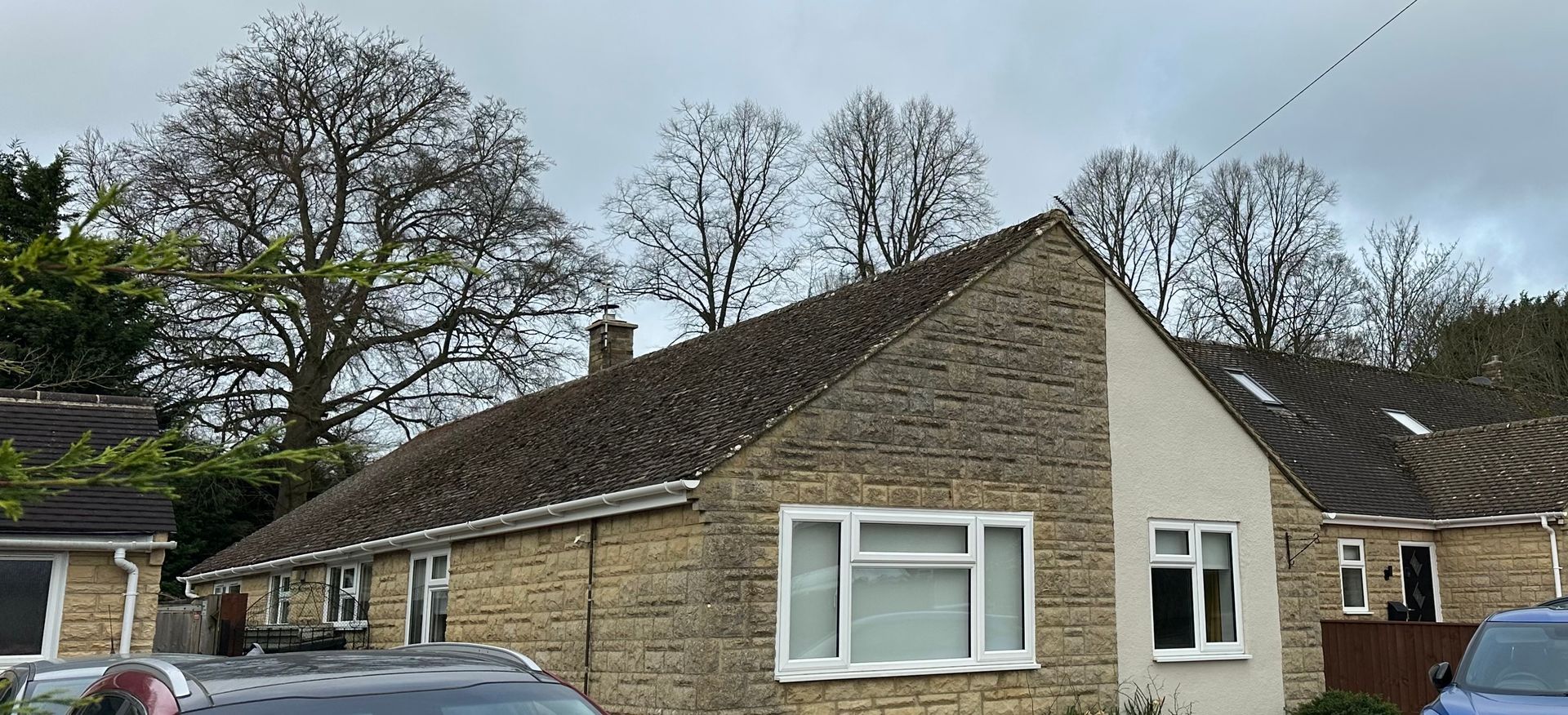Close-up of solar panels mounted vertically on a tiled gable wall