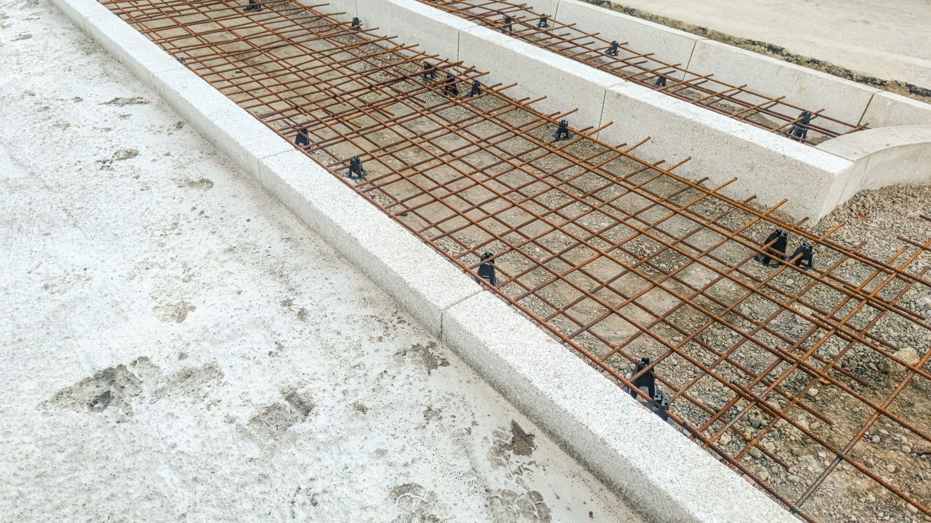 Residential driveway construction site with forms set for concrete pour