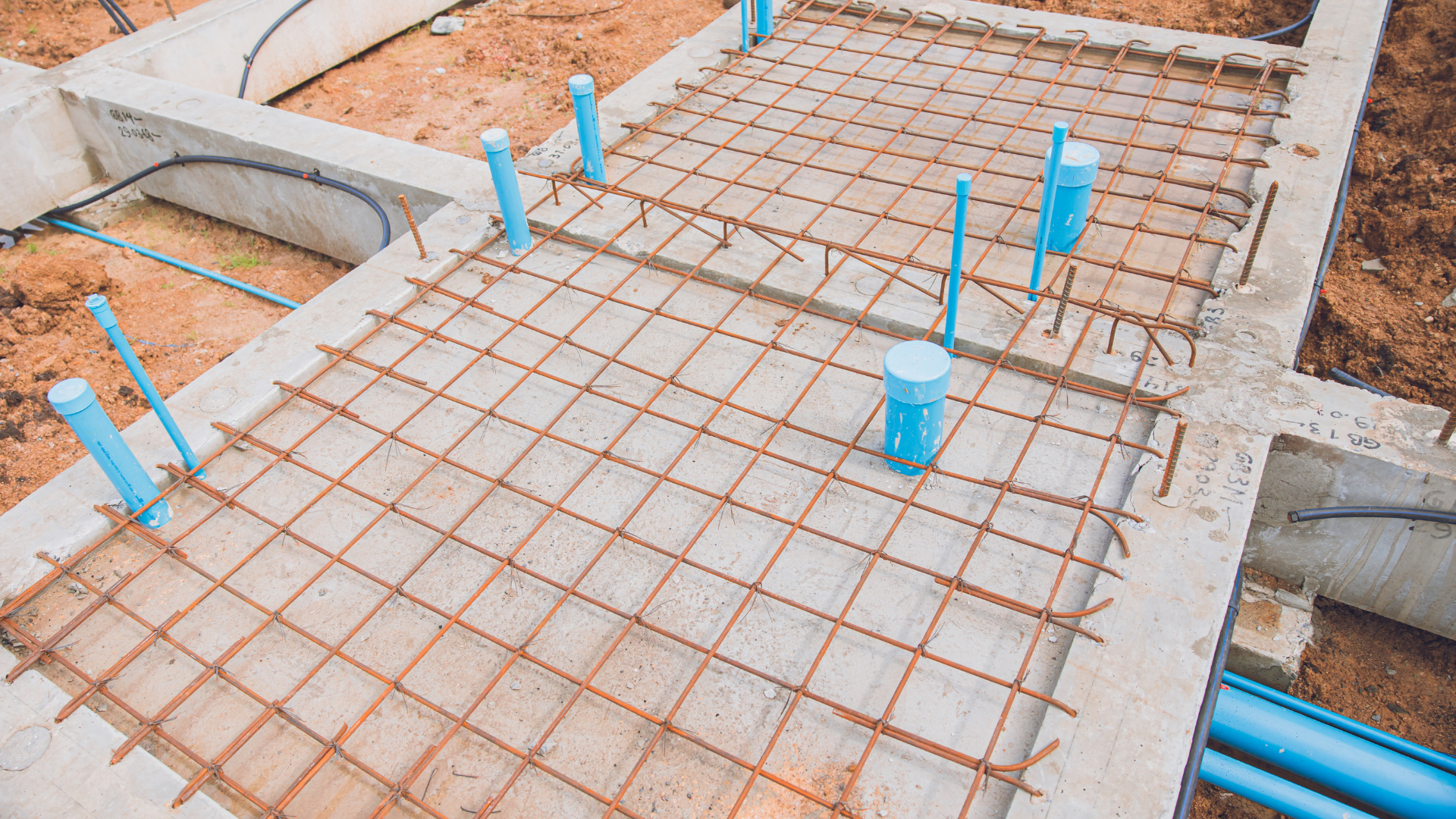 Smithtown NY homeowners watching concrete driveway installation process in progress