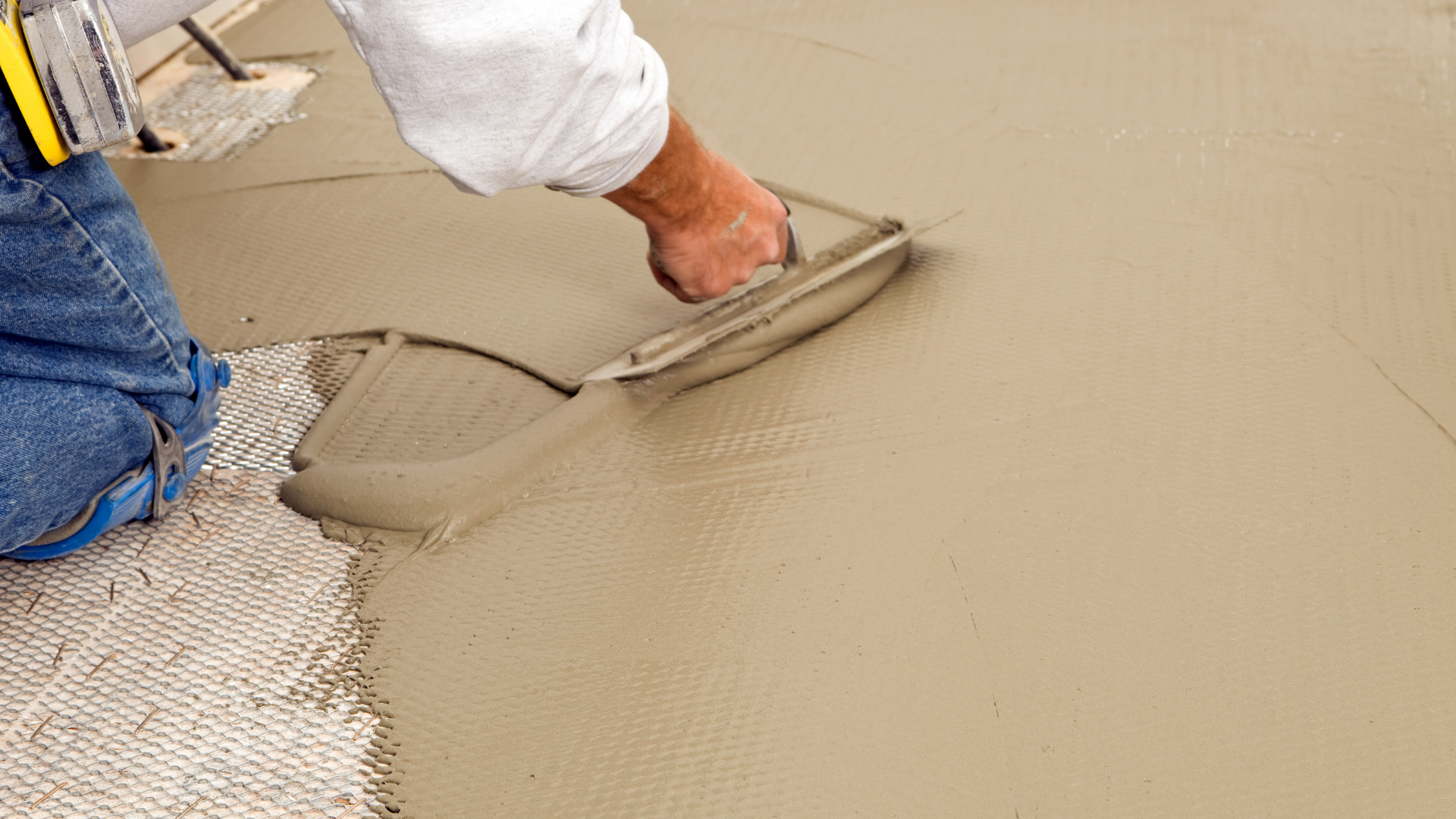 Waterproofing specialists sealing basement walls against water intrusion damage