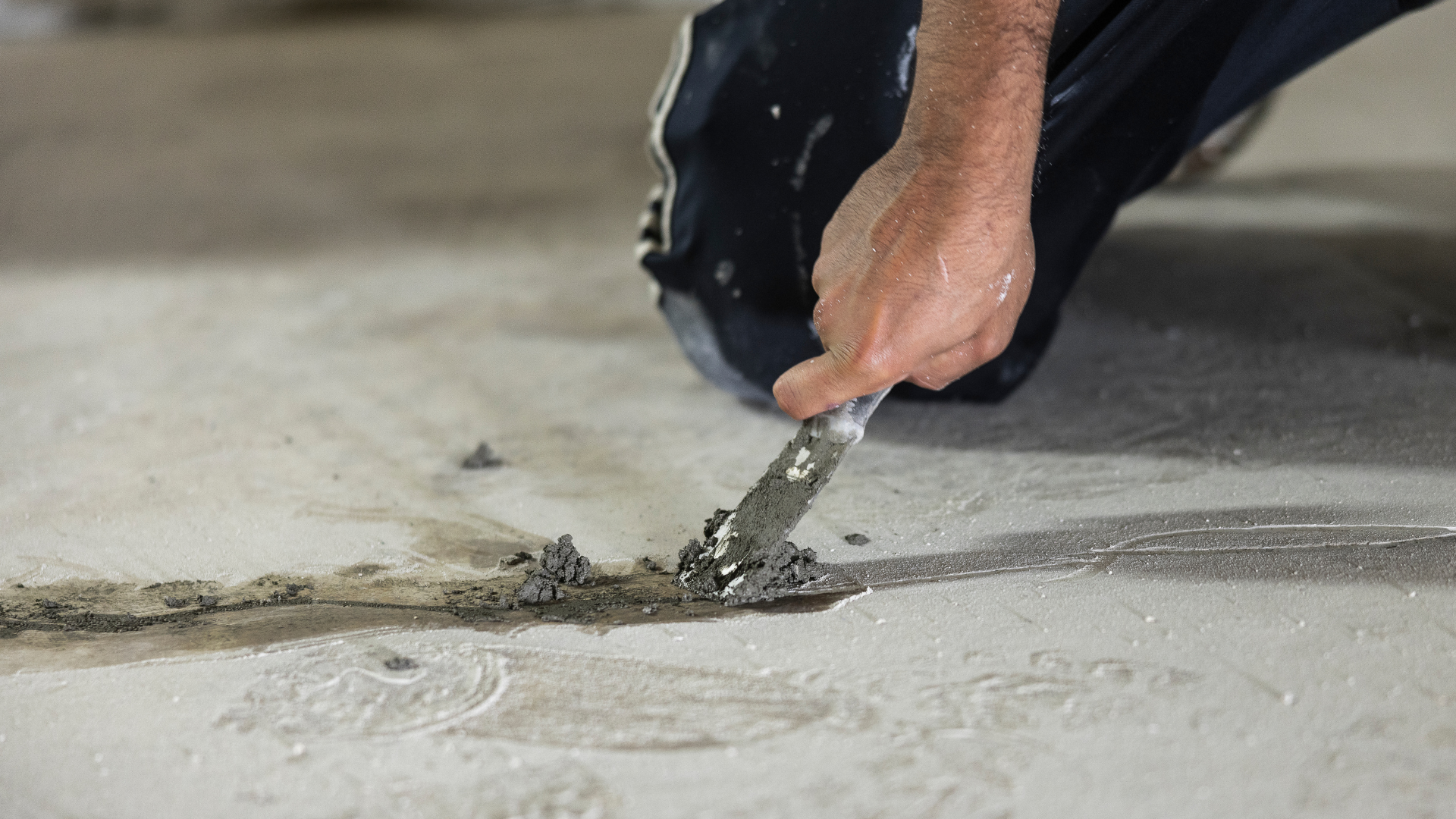 Residential foundation repair work reinforcing cracked basement structure