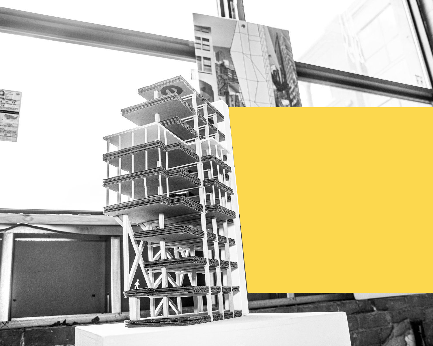 A black and white photo of a model of a building