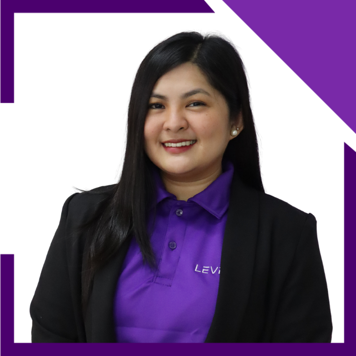 A woman wearing a purple levi shirt and a black jacket